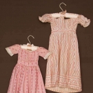 TWO PINK TODDLERS' DRESSES, 1820-1840
