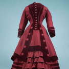 GARNET POLONAISE VISITING DRESS, LATE 1860s