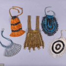 FIVE KNITTED BEADED BAGS, 1920s
