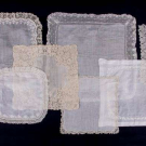 EIGHT LACE OR EMBROIDERED HANDKERCHIEFS, 1890-1920
