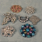 7 RHINESTONE BROOCHES, MID 20th C