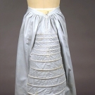 BLUE GINGHAM LOBSTER TAIL BUSTLE, 1870s
